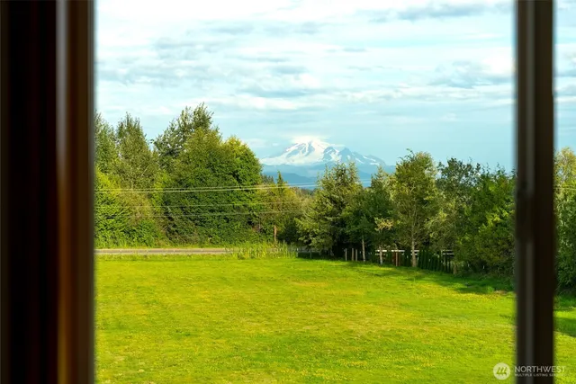 a view of a swimming pool with a yard