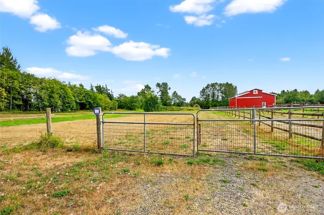an aerial view of a house with a lake view