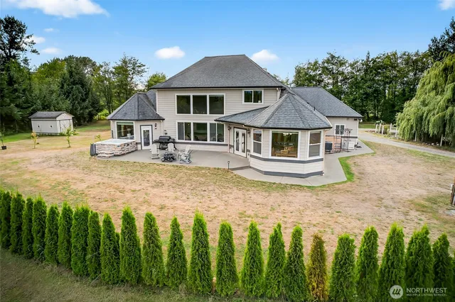 a front view of a house with yard and green space