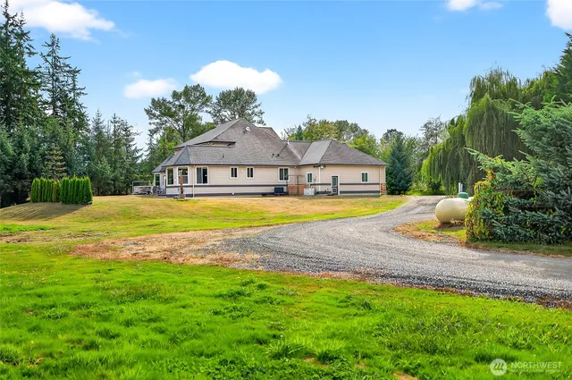 a view of a hallway with a dining table