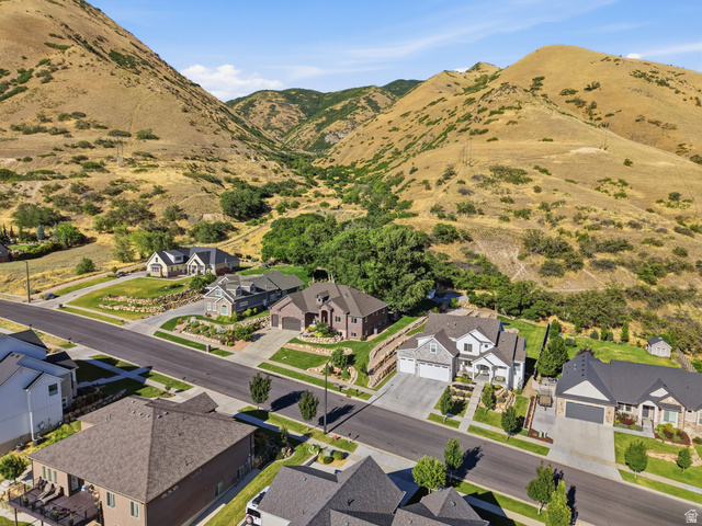 441 South 2080th Street East Springville, UT 84663 - Photo 6 of 64 Neighborhood setting featuring modern homes and paved roadways amidst mountain terrain