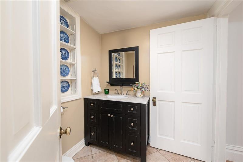 304 Quaker Road Sewickley, PA 15143 - Photo 11 of 25 A powder room on the main level adds convenience for guests.