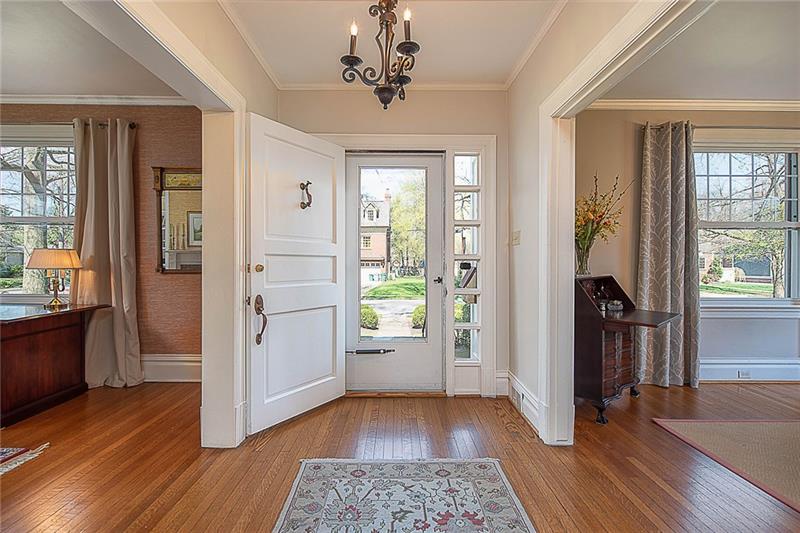 304 Quaker Road Sewickley, PA 15143 - Photo 3 of 25 Guests are welcomed by the grand foyer with its classic moldings and hardwood floors.