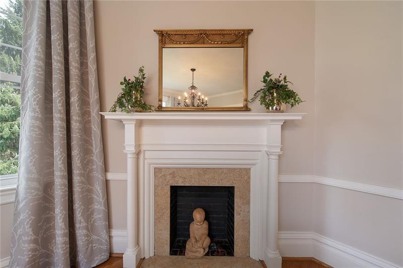 304 Quaker Road Sewickley, PA 15143 - Photo 5 of 25 The fireplace in the dining room depicts the classical molding and trim detail throughout.