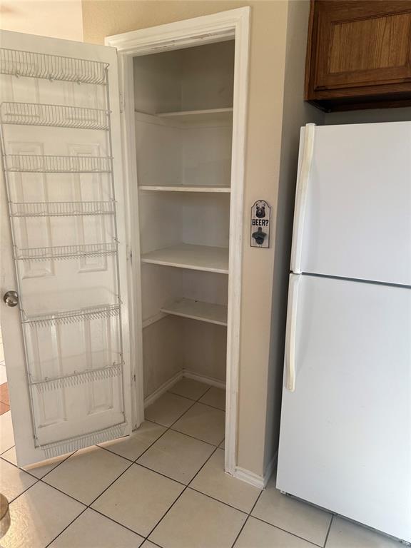 900 Reese Lane Azle, TX 76020 - Photo 15 of 15 a view of walk in closet with empty racks