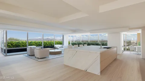 a living room with a couch and a large window