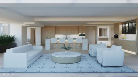 a living room with furniture and a dining table