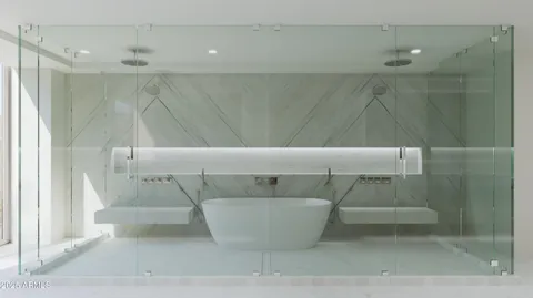 a bathroom with a bathtub and shower