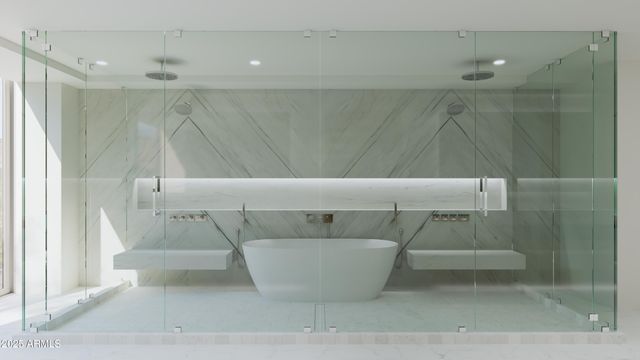 a bathroom with a bathtub and shower