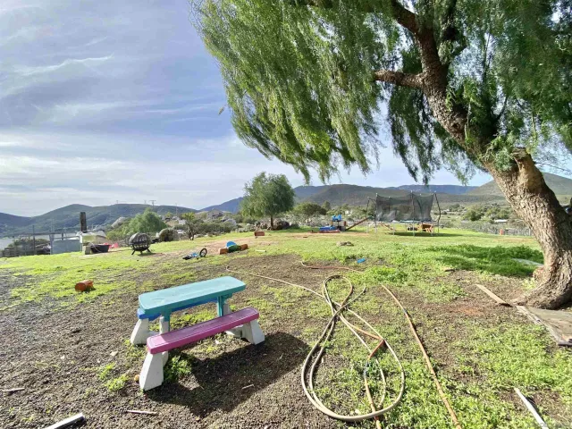 a view of a water fountain and a big yard