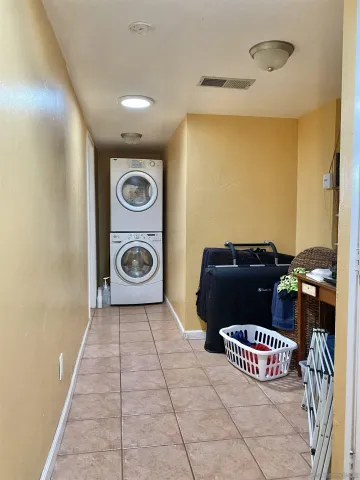 a view of a porch with furniture and a garage