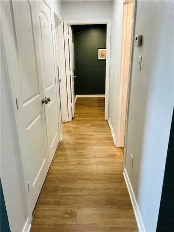 a view of yellow house with a yard