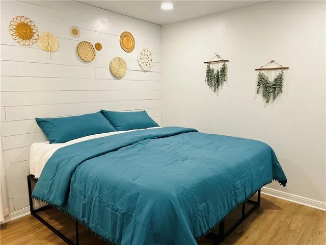 a bedroom with a bed and a chair