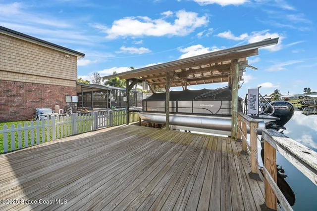 a living room with stainless steel appliances kitchen island granite countertop furniture and a fireplace