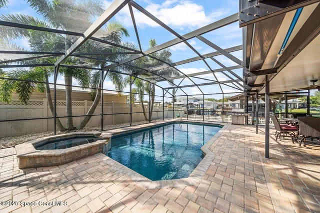 a view of a workspace with furniture and a kitchen
