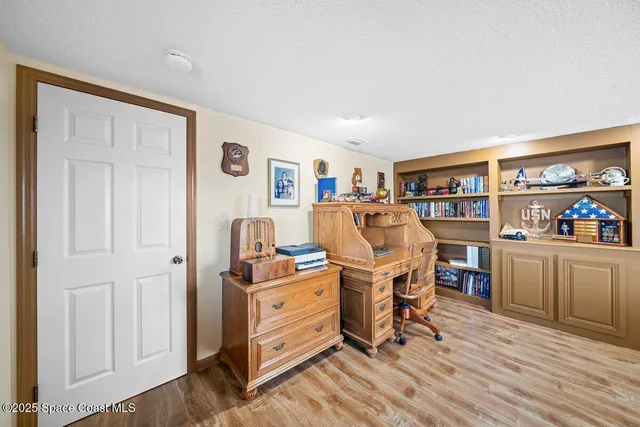 a spacious bathroom with a double vanity sink a mirror and a shower