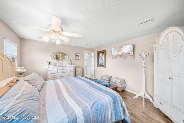 a dining room with furniture a rug and wooden floor
