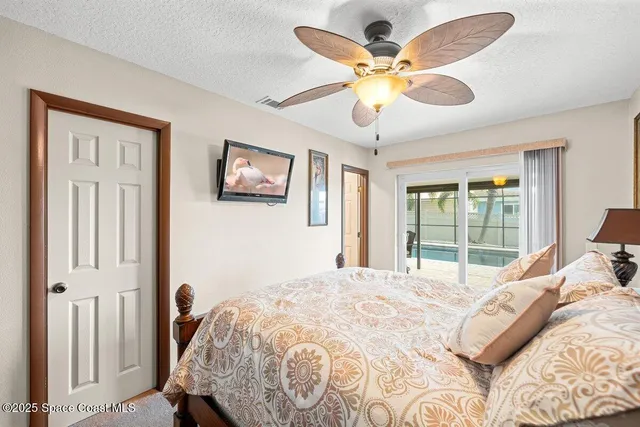 a dining hall with stainless steel appliances granite countertop a stove a kitchen island with chairs and wooden floor