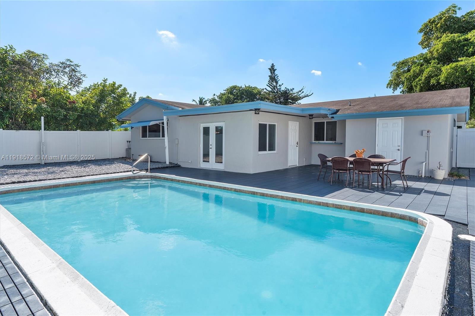 2012 Northwest 11th Avenue Fort Lauderdale, FL 33311 - Photo 11 of 15 a swimming pool with outdoor seating and yard