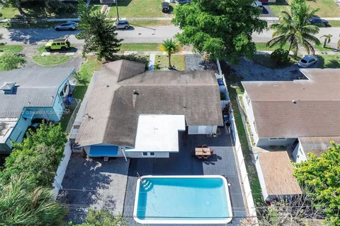 an aerial view of a house with outdoor space