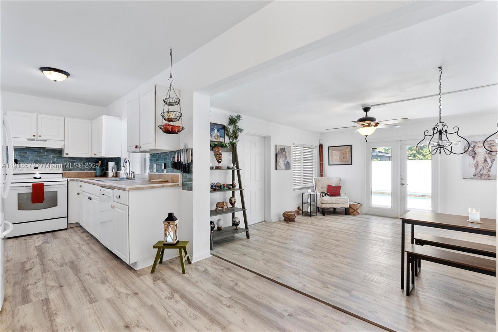 2012 Northwest 11th Avenue Fort Lauderdale, FL 33311 - Photo 4 of 15 a living room with furniture and a wooden floor