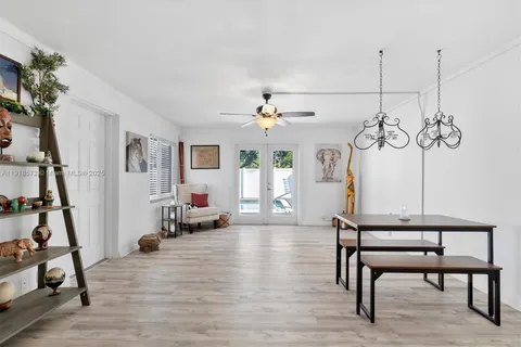 a view of a livingroom with furniture and a window