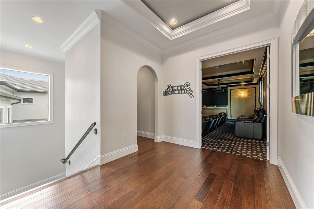 460 Muirfield Loop Reunion, FL 34747 - Photo 13 of 60 a view of a hallway view with wooden floor and furniture