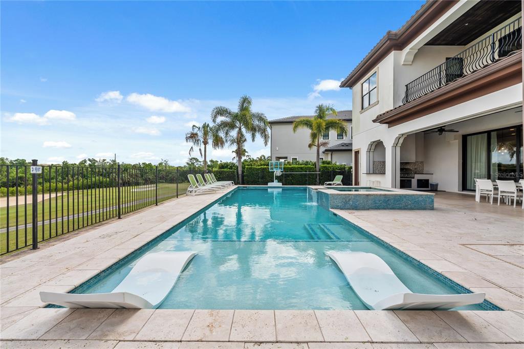 460 Muirfield Loop Reunion, FL 34747 - Photo 51 of 60 a view of a swimming pool with a fountain