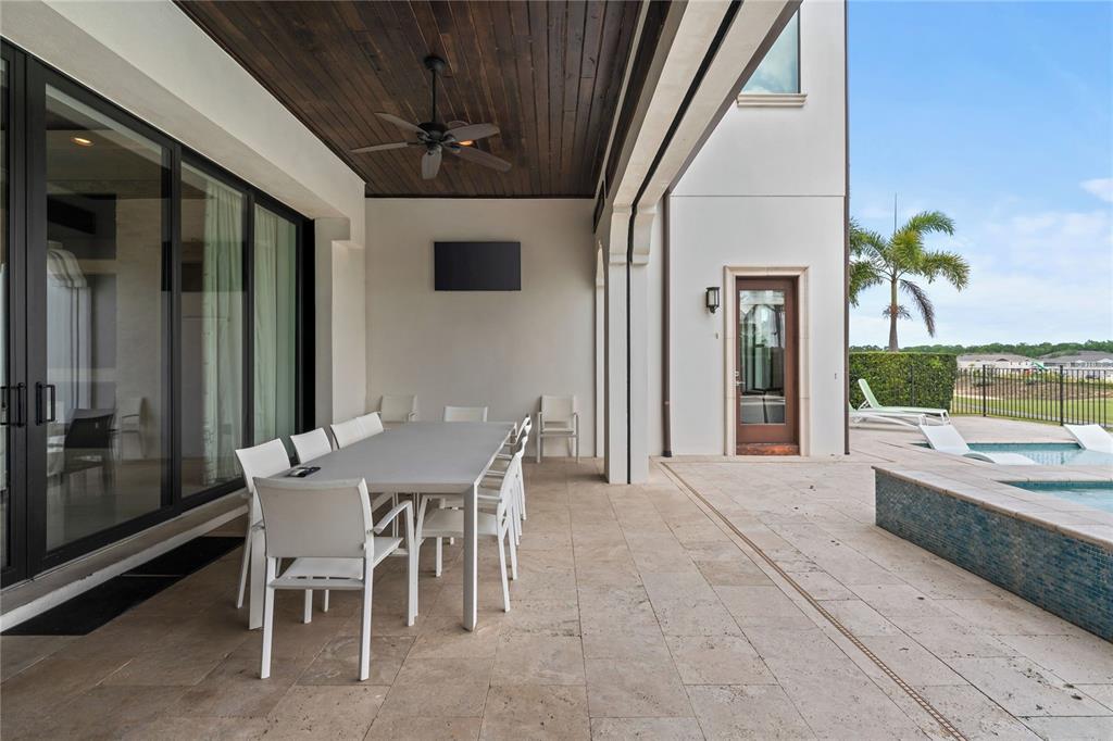 460 Muirfield Loop Reunion, FL 34747 - Photo 57 of 60 a view of a dining room with furniture window and wooden floor