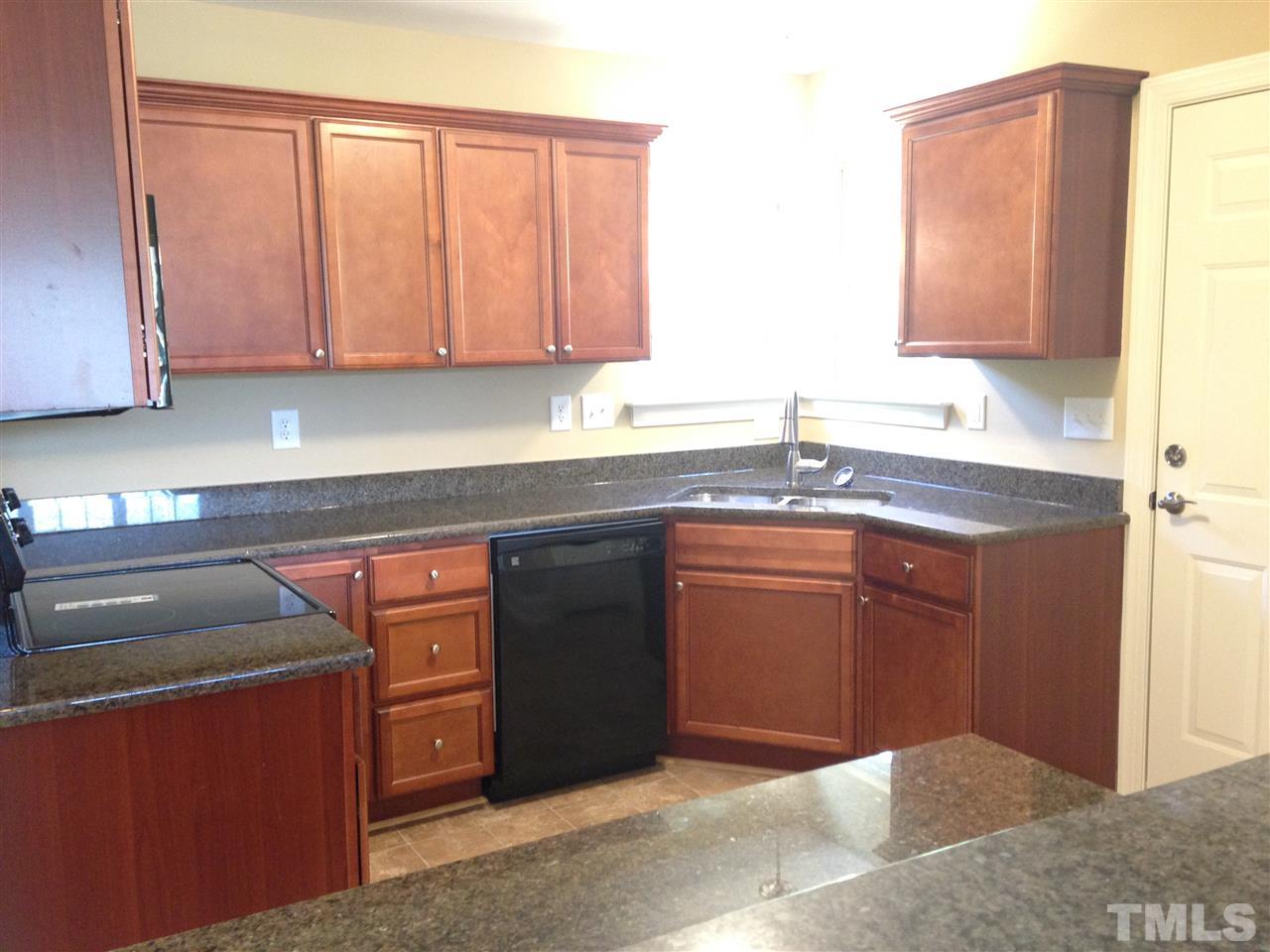 106 Orkney Road Stem, NC 27581 - Photo 5 of 21 a kitchen with stainless steel appliances granite countertop a sink stove and cabinets