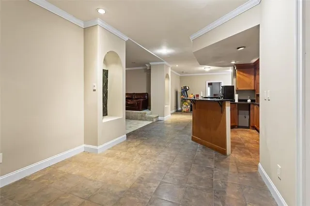 a view of kitchen with refrigerator and window