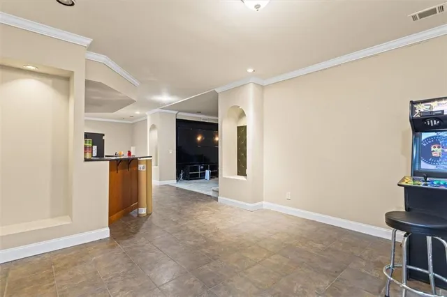a view of kitchen with furniture and a refrigerator