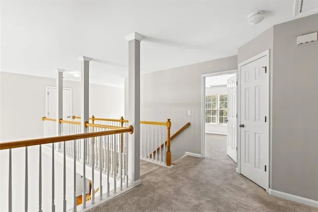 a view of a hallway with windows