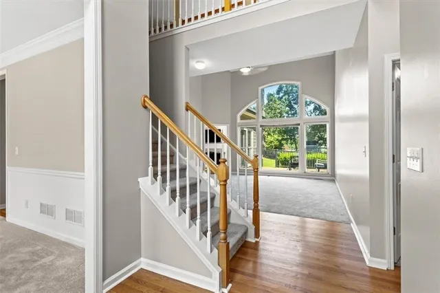 a view of an entryway with wooden floor