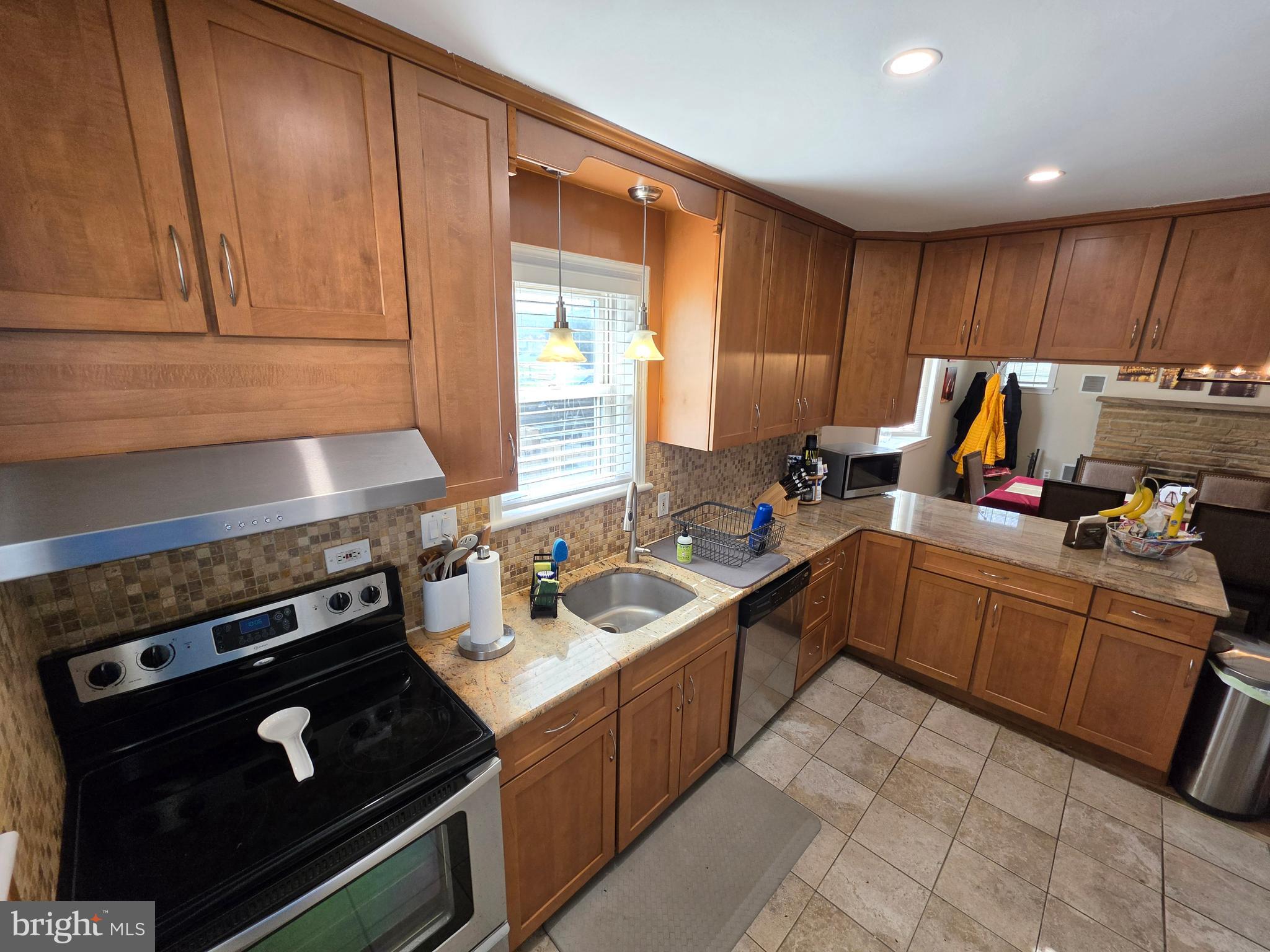 142 New Road Horsham, PA 19044 - Photo 8 of 38 a kitchen with a stove sink and cabinets