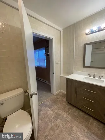 a view of an empty room and fire place