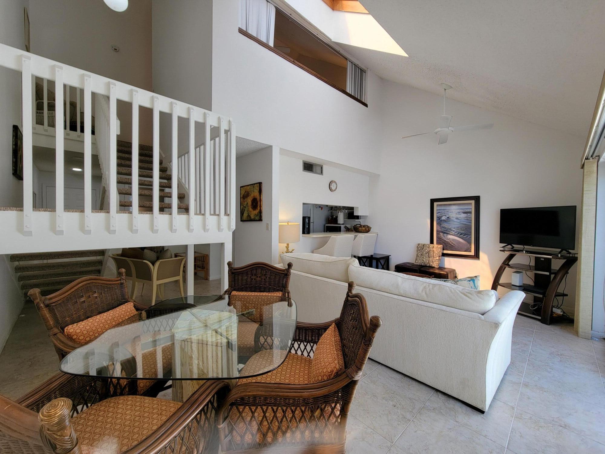 1605 Highway 1, Unit M2210 Jupiter, FL 33477 - Photo 11 of 28 a living room with furniture and a flat screen tv