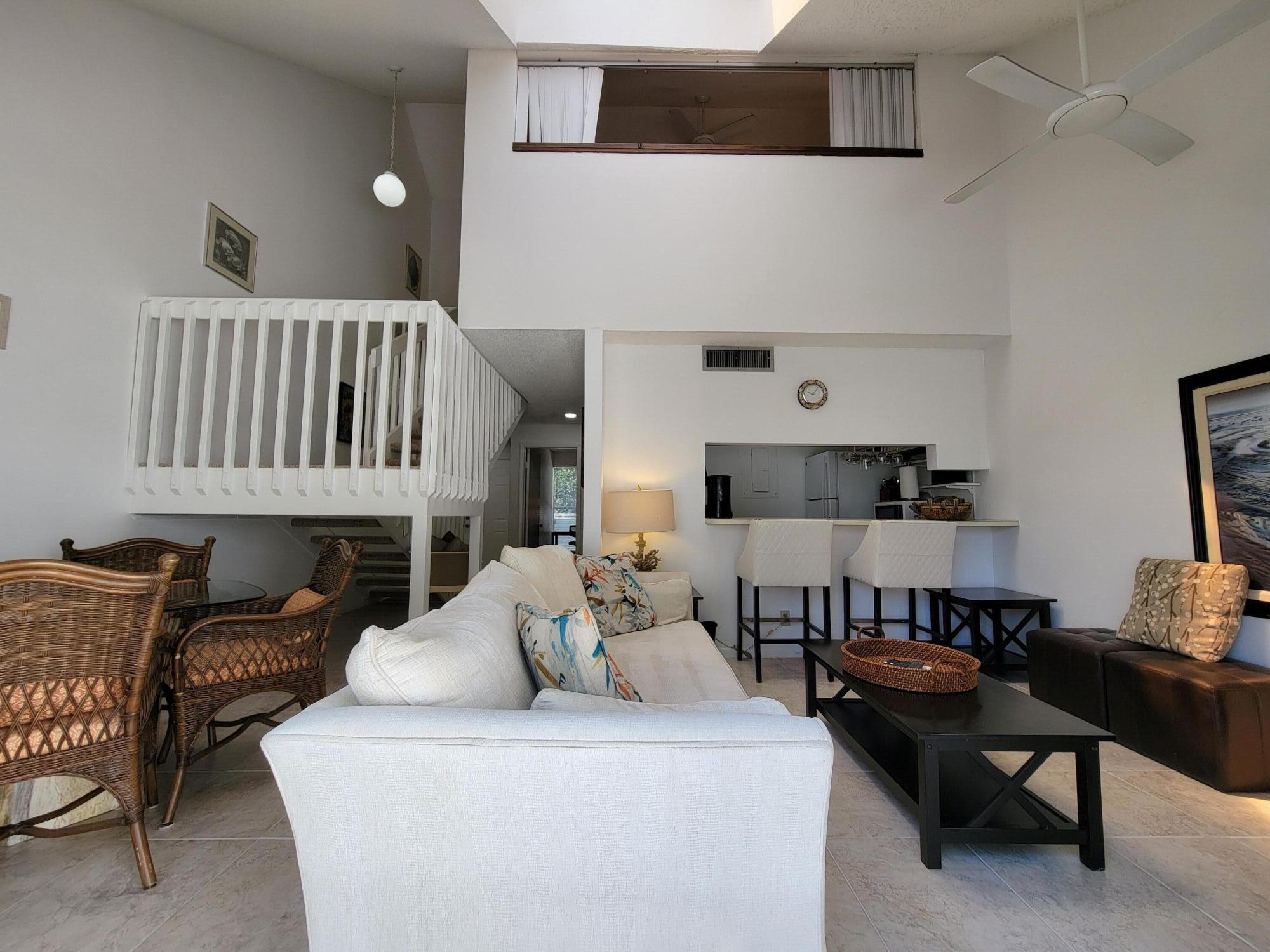 1605 Highway 1, Unit M2210 Jupiter, FL 33477 - Photo 17 of 28 a living room with furniture and a window