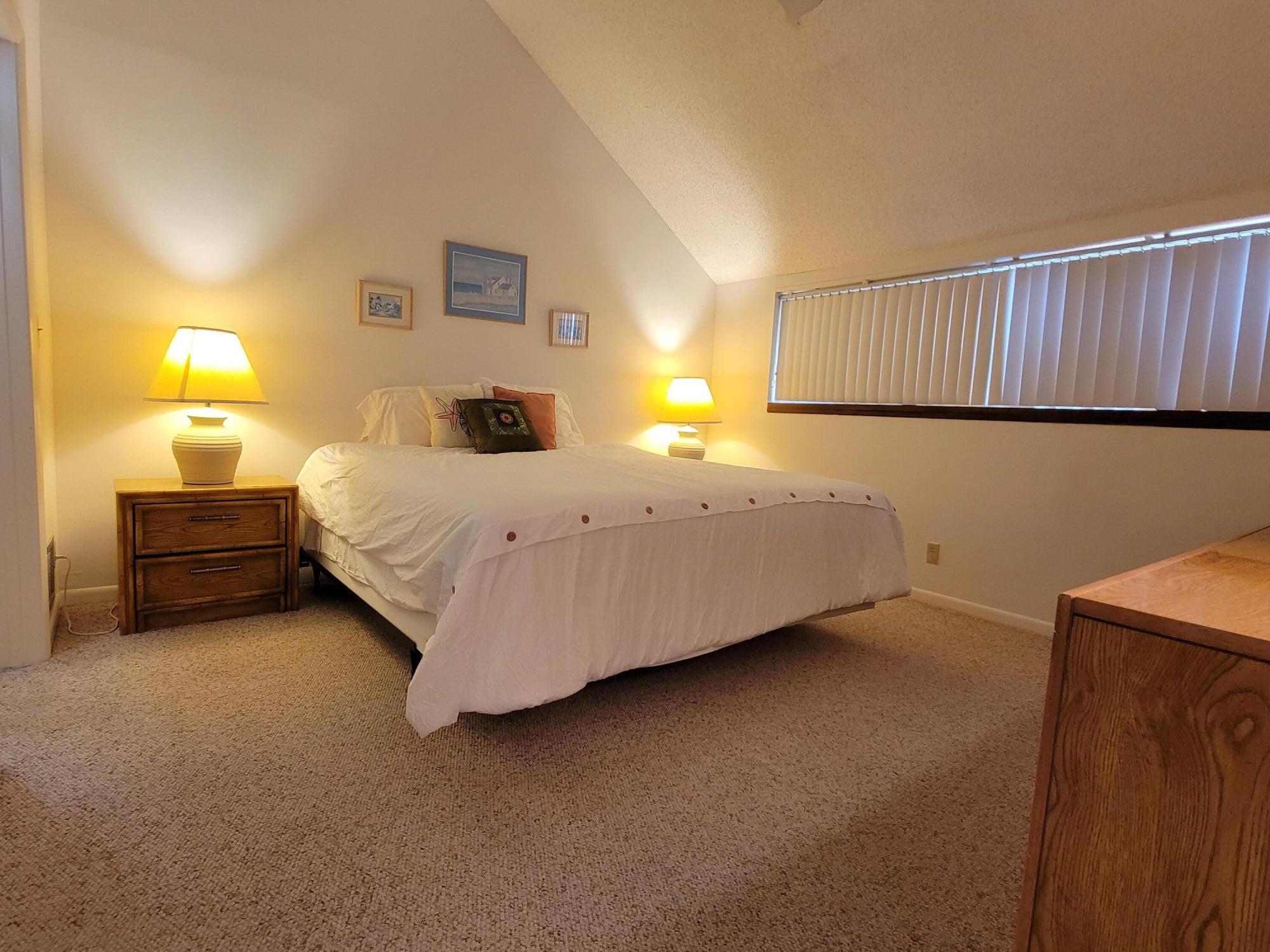 1605 Highway 1, Unit M2210 Jupiter, FL 33477 - Photo 19 of 28 a bedroom with a bed and a window