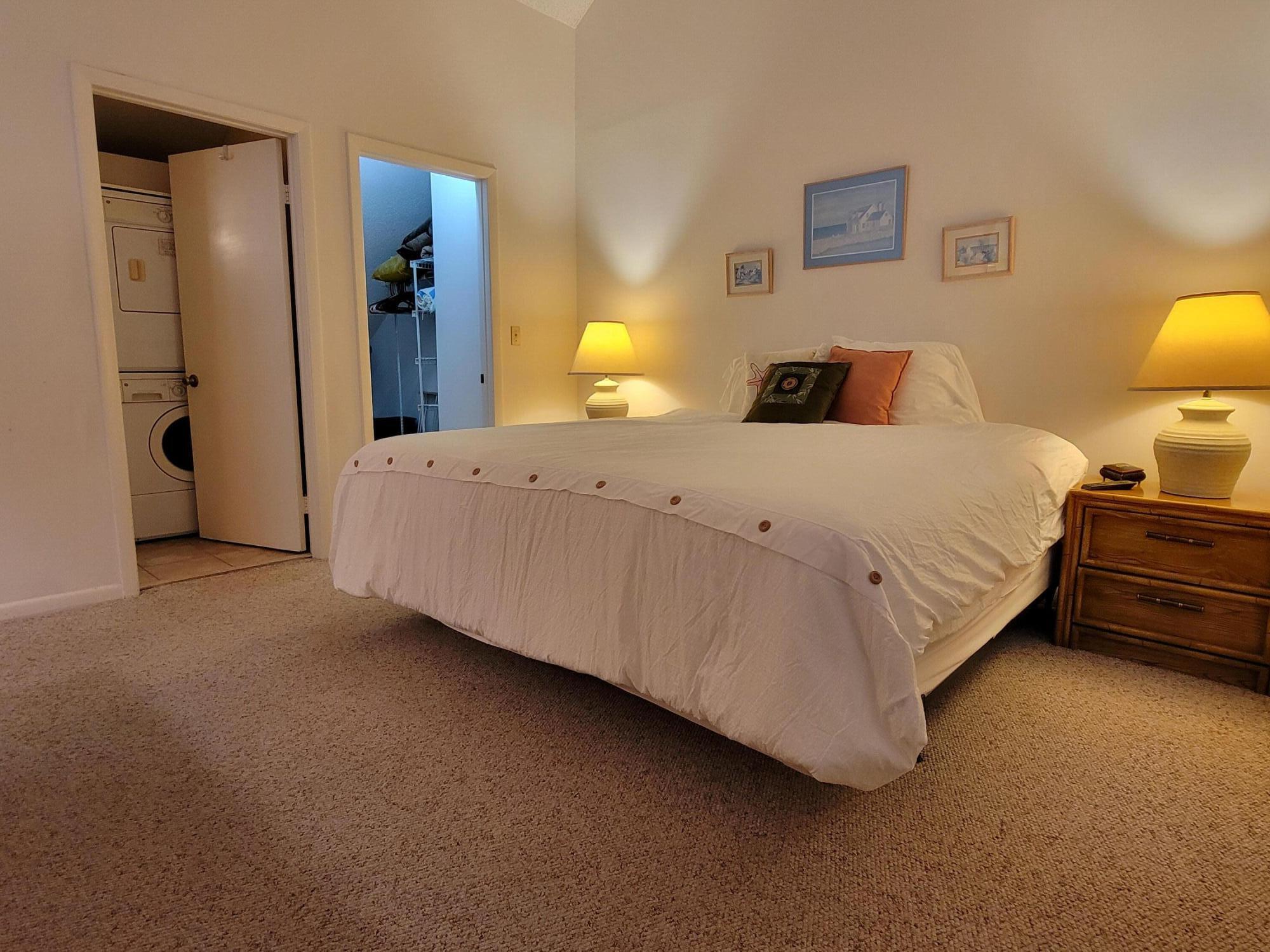 1605 Highway 1, Unit M2210 Jupiter, FL 33477 - Photo 20 of 28 a bed room with a bed and lamp