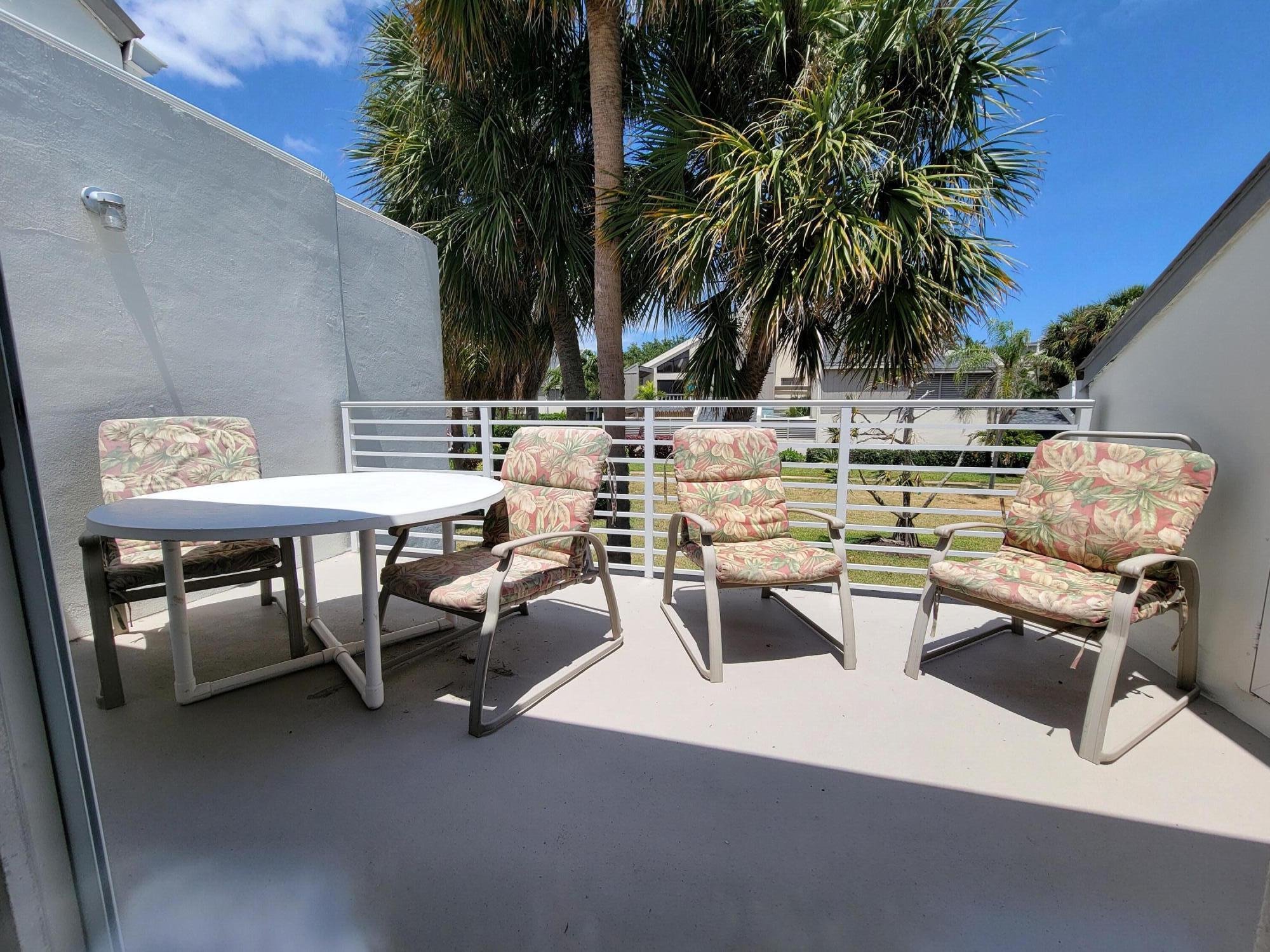 1605 Highway 1, Unit M2210 Jupiter, FL 33477 - Photo 24 of 28 a view of a swimming pool with chairs
