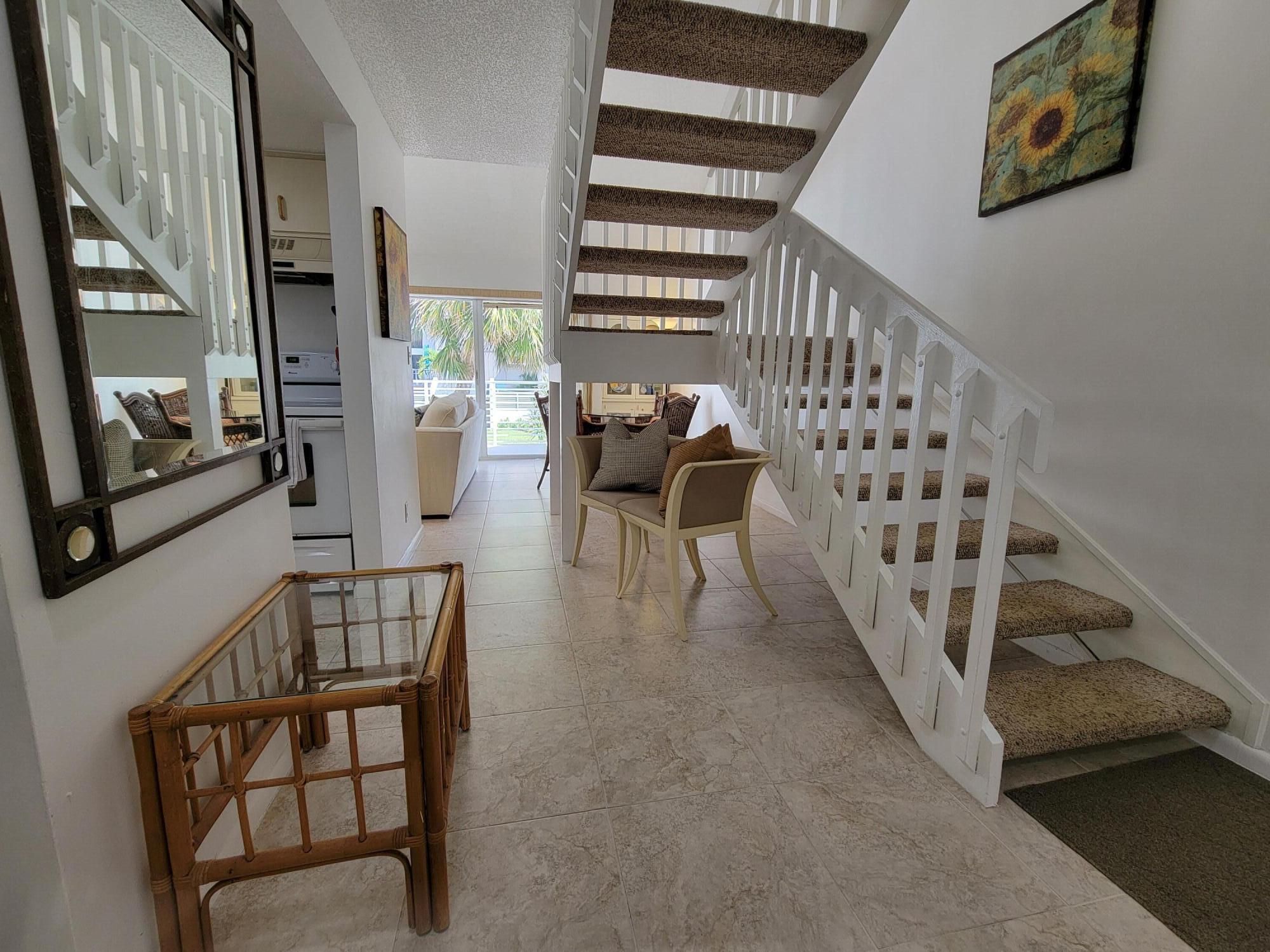 1605 Highway 1, Unit M2210 Jupiter, FL 33477 - Photo 4 of 28 a view of entryway and hall with wooden floor