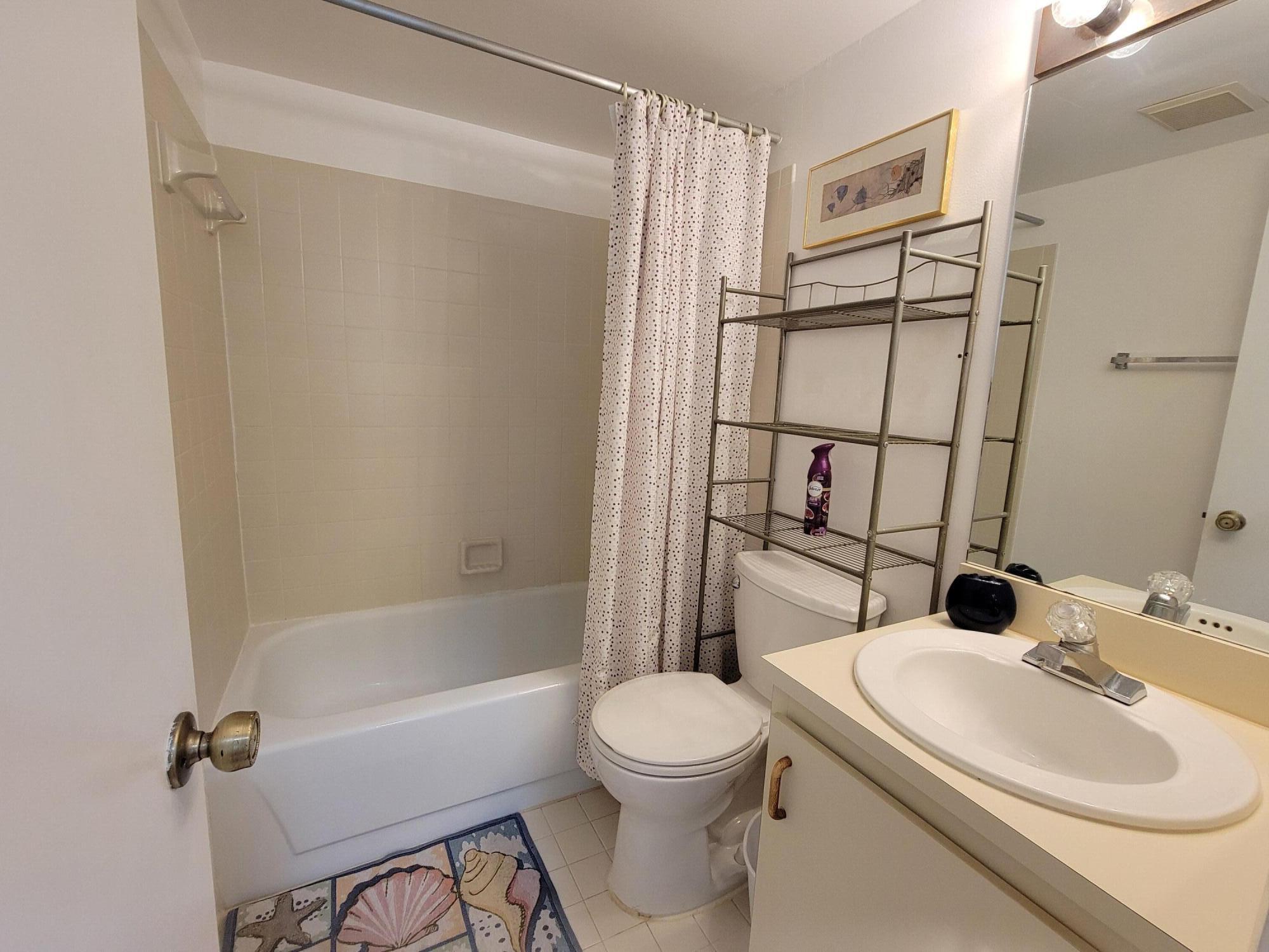 1605 Highway 1, Unit M2210 Jupiter, FL 33477 - Photo 8 of 28 a bathroom with a sink toilet and shower