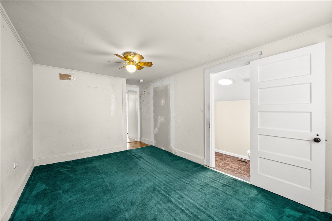 47 Square Street Pelzer, SC 29669 - Photo 17 of 29 A spacious flex room leads directly into an adjacent bathroom.