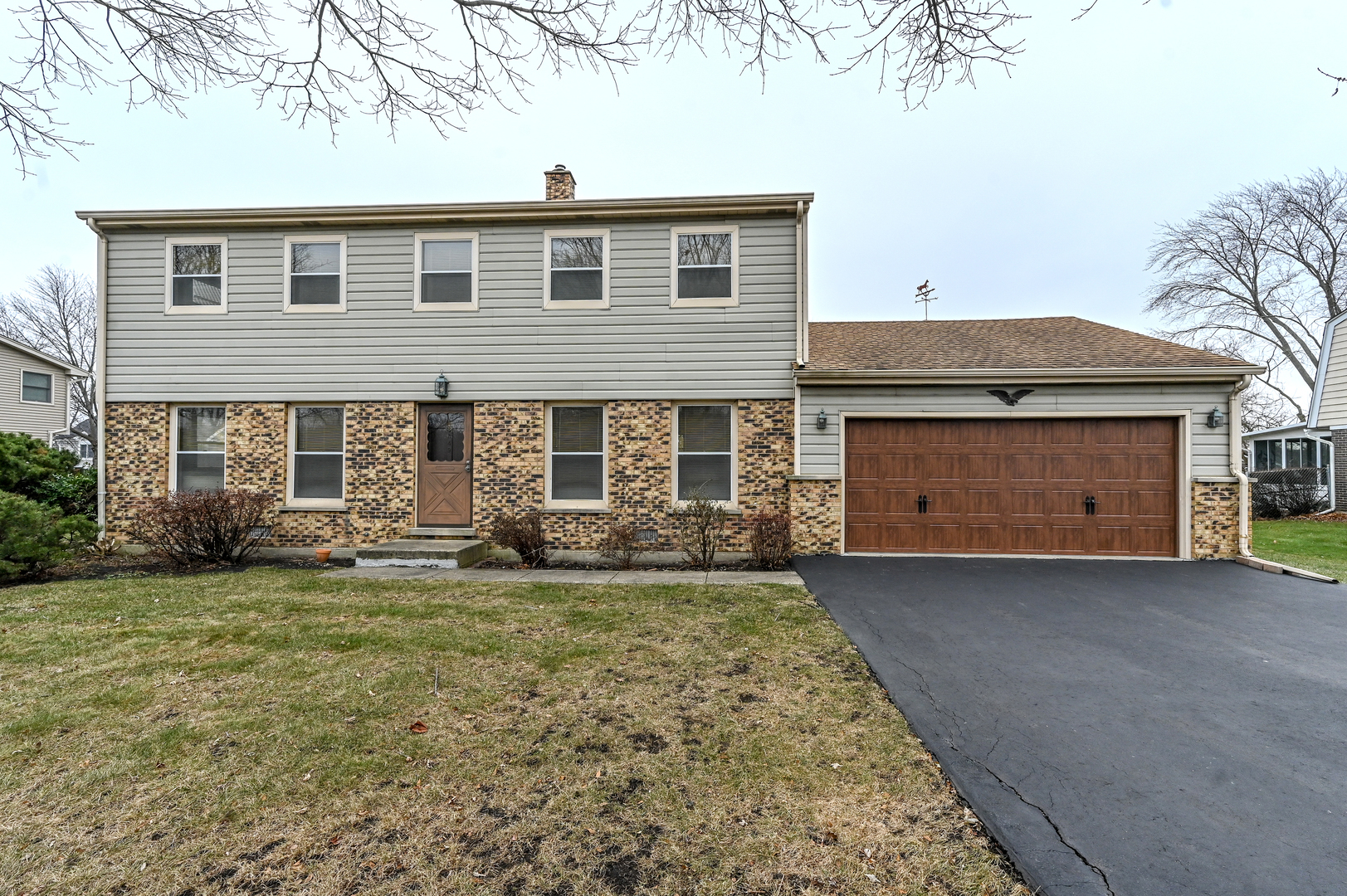 249 South Arlington Heights Road Elk Grove Village, IL 60007 - Photo 1 of 21 a front view of a house with a garden and yard