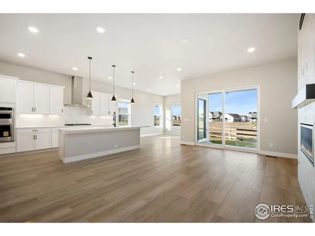 a kitchen with white cabinets appliances and sink