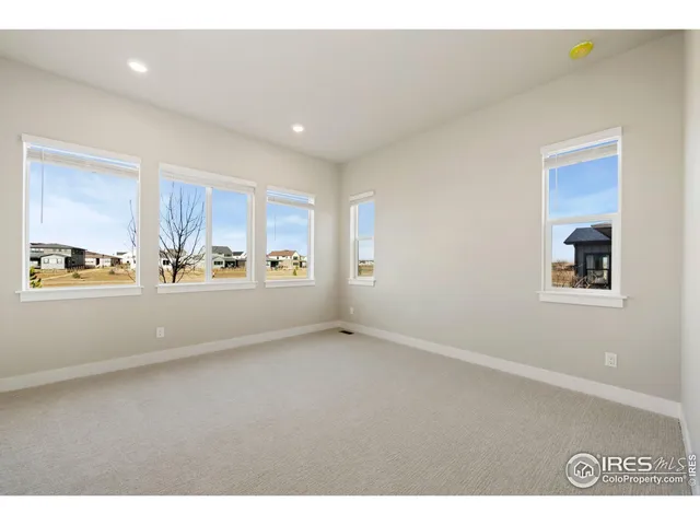 a spacious bathroom with a double vanity sink a mirror and a bathtub