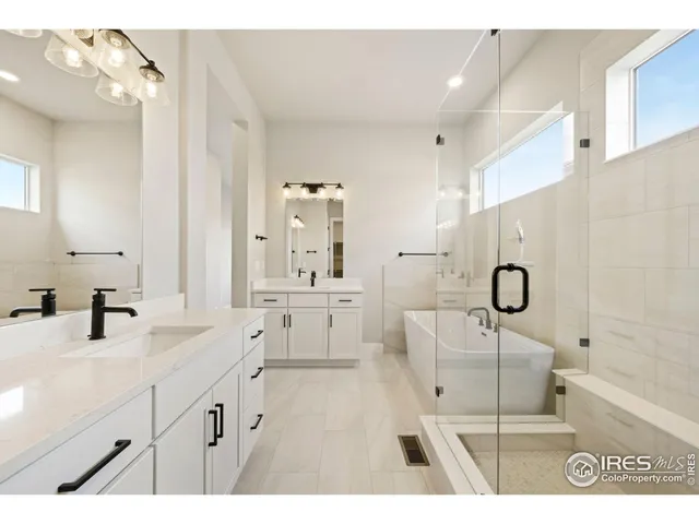 a black white and white photo of a living room