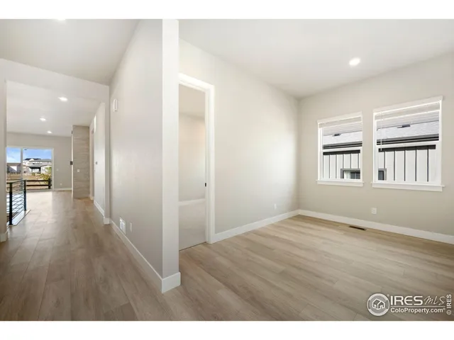 a view of large kitchen with wooden floor