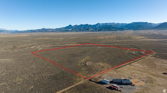 2455 East Cale Road Panguitch, UT 84759 - Photo 12 of 12 View of rural area featuring a mountain backdrop and property parcel outlined